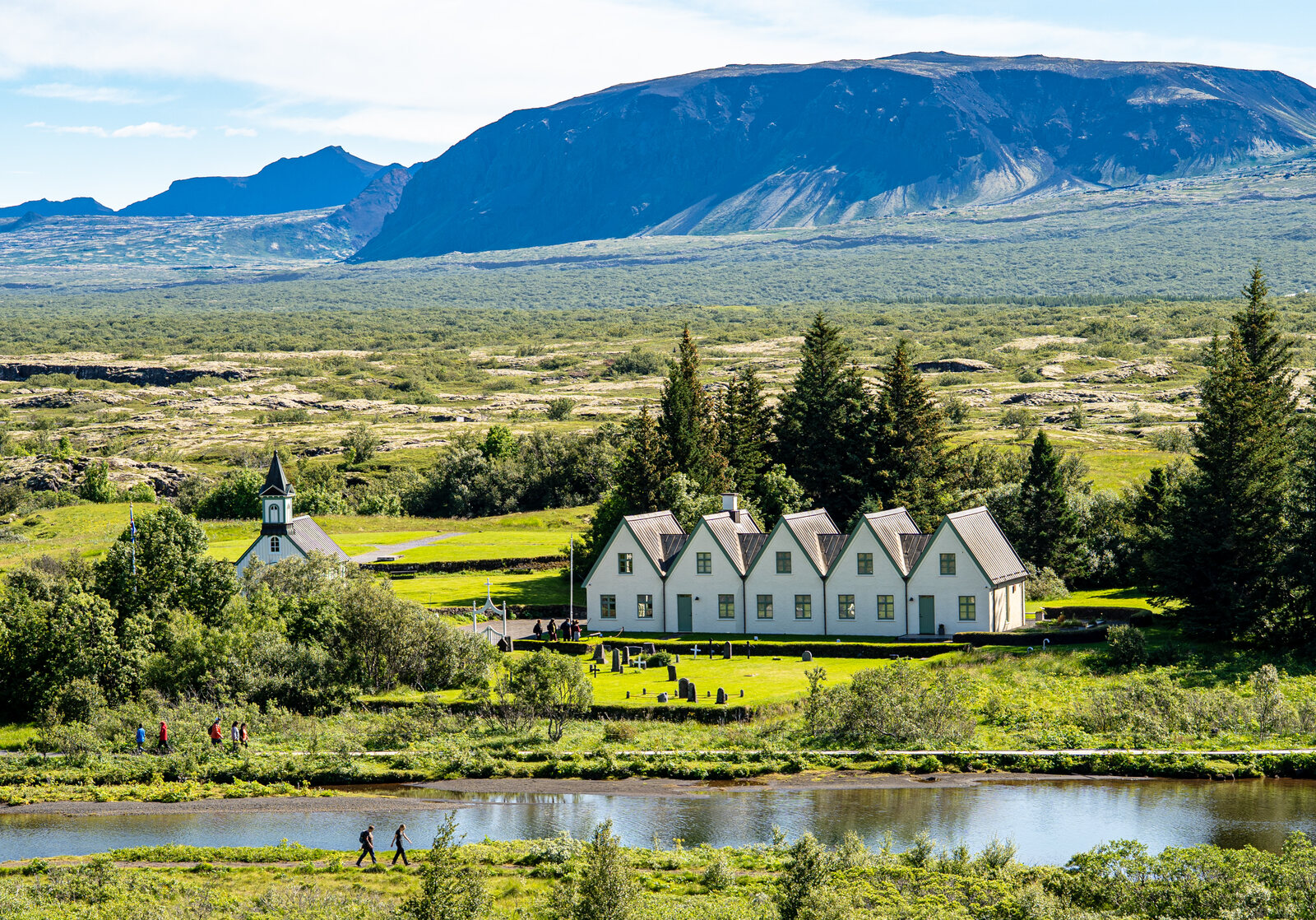 Þingvellir: the church and turf-roofed farm buildings in the rift valley, mountains behind
